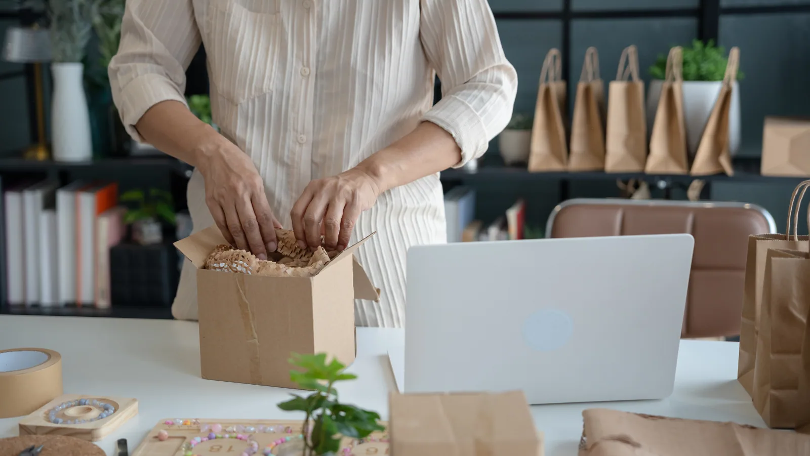 Entrepreneur packing products for delivery